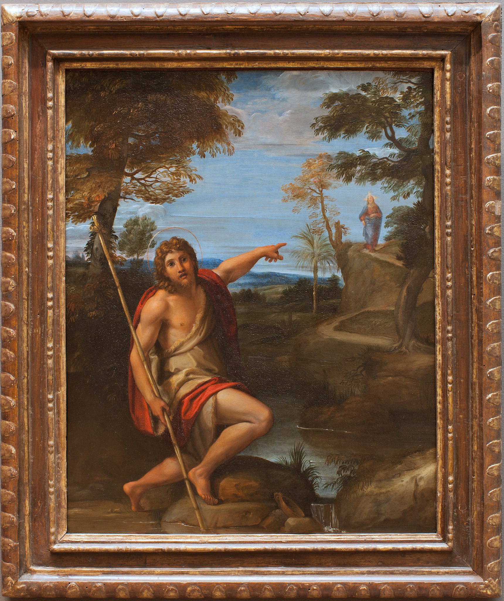 Kuvassa Johannes Kastaja, joka osoittaa kaukana olevaa Jeesusta.