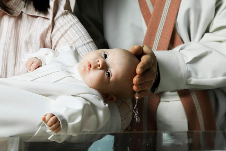 A baby is being baptised.
